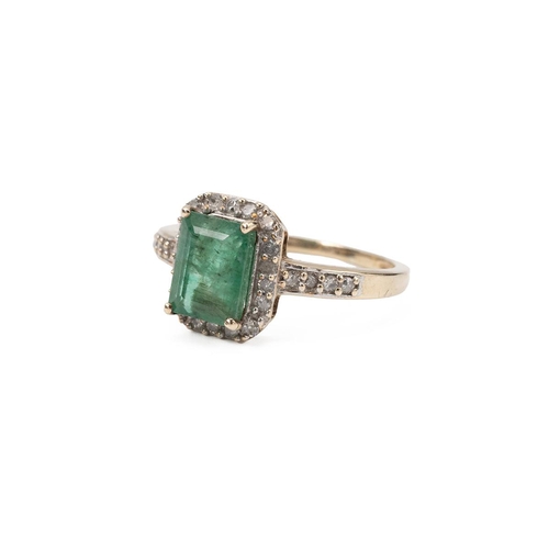 1 - 9ct gold and emerald ring, the central emerald cut stone surrounded with a halo of diamonds to the o... 