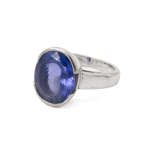 6 - 18ct white gold and tanzanite ring, the single oval stone measuring approximately 8.35 carats, finge... 