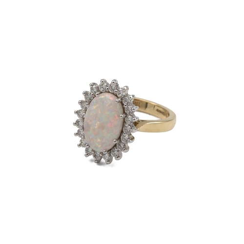 23 - 18ct gold, diamond and opal cluster ring, the central oval cabochon stone measuring 8mm x 8mm, surro... 