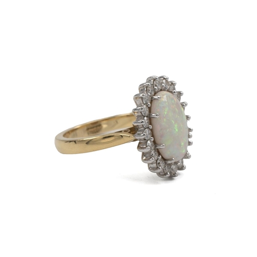 23 - 18ct gold, diamond and opal cluster ring, the central oval cabochon stone measuring 8mm x 8mm, surro... 