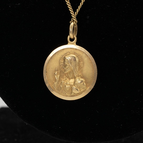 64 - Saint Christopher pendant and chain, unmarked, tested as 18ct, along with an 18ct gold signet ring, ... 