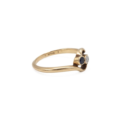 74 - 18ct stamped gold sapphire and diamond ring, the central diamond approx 0.1 carats, flanked by two s... 