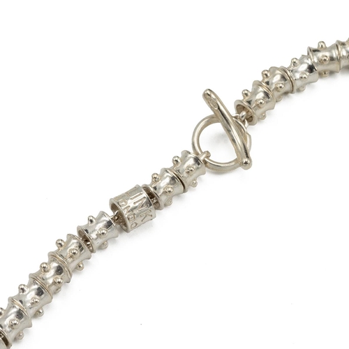 94 - Links Of London, a studded necklace with a starfish pendant, marked '925', 61 grams, boxed.