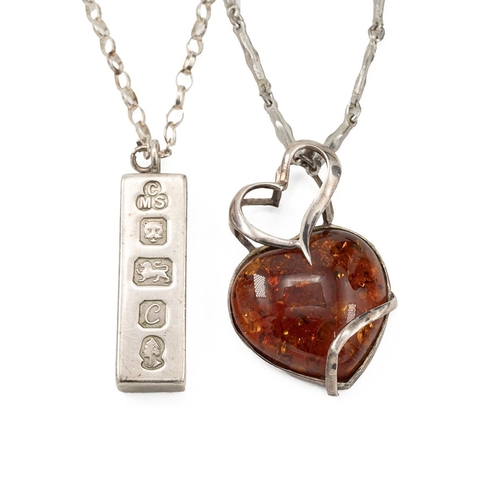 98 - Silver ingot pendant and chain, along with heart-shaped amber pendant, 63 grams.