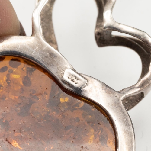 98 - Silver ingot pendant and chain, along with heart-shaped amber pendant, 63 grams.