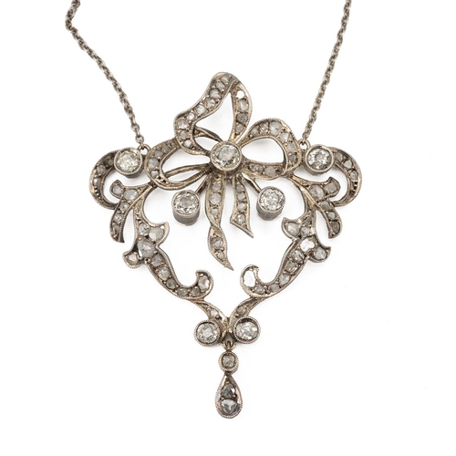 118 - An Edwardian diamond set pendant necklace, the shaped openwork frame set with old and rose cut diamo... 