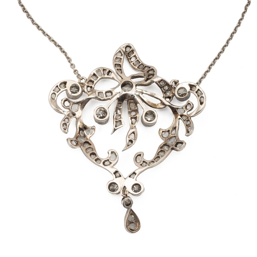 118 - An Edwardian diamond set pendant necklace, the shaped openwork frame set with old and rose cut diamo... 