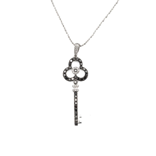 131 - White metal, black and white diamond bespoke pendant in the form of a key to a white metal chain, st... 