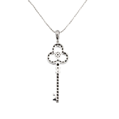 131 - White metal, black and white diamond bespoke pendant in the form of a key to a white metal chain, st... 