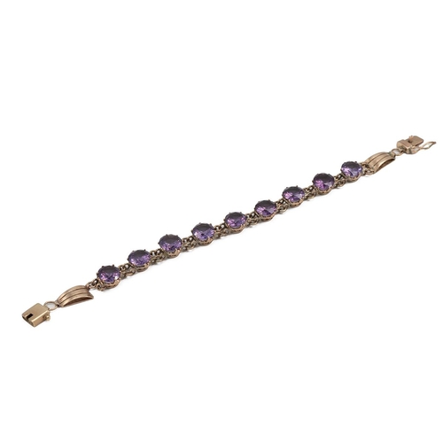 144 - Yellow metal mounted bracelet, set with nine synthetic colour change sapphires, each in a claw setti... 