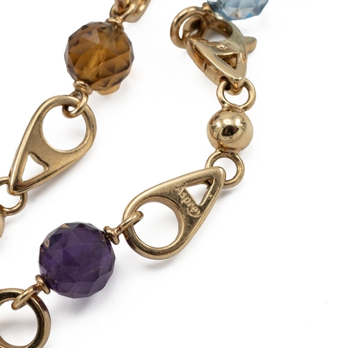 154 - Asprey's London, an 18ct gold link bracelet with four faceted spherical charms in aquamarine, citrin... 