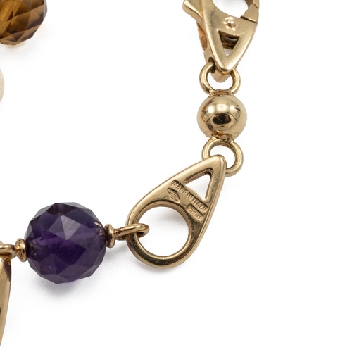 154 - Asprey's London, an 18ct gold link bracelet with four faceted spherical charms in aquamarine, citrin... 