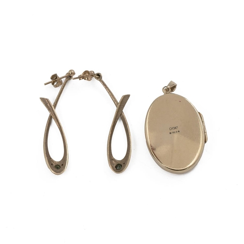 163 - 9ct gold oval locket, along with a pair of 9ct earrings, 13 grams.