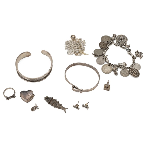 207 - A collection of silver and white metal jewellery including charms, bangles and other items, 130 gram... 