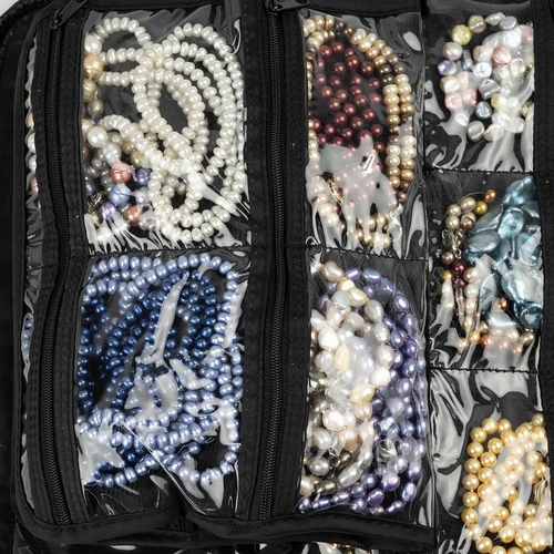 220 - Large collection of freshwater and cultured pearls, necklaces, and beads.