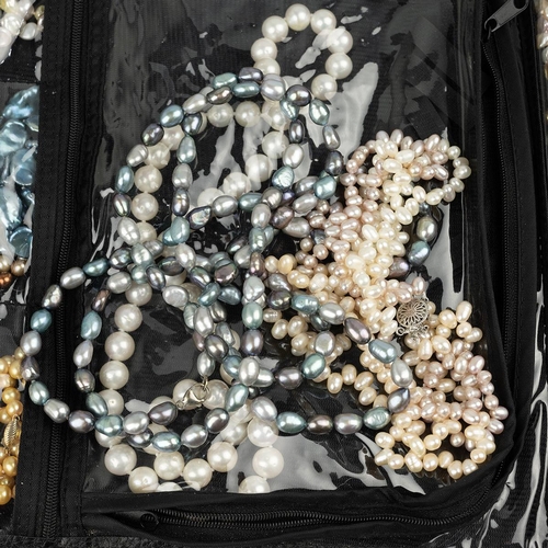 220 - Large collection of freshwater and cultured pearls, necklaces, and beads.