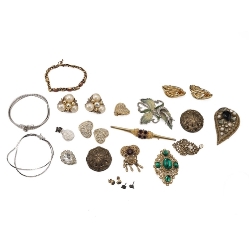 223 - Vintage costume jewellery, including earrings, brooches, silver necklaces, with a decorative wirewor... 