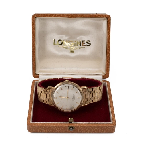 283 - Vintage gents Longines Flagship automatic 9ct gold wristwatch and strap. Silvered dial with gold bat... 