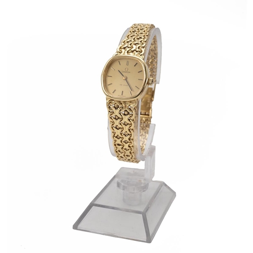 285 - Ladies 18ct gold Omega wristwatch with integrated 18ct gold chainlink bracelet strap hallmarked 750 ... 