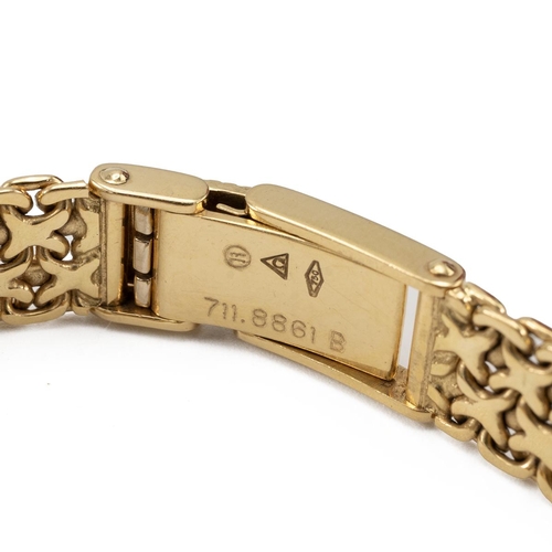 285 - Ladies 18ct gold Omega wristwatch with integrated 18ct gold chainlink bracelet strap hallmarked 750 ... 