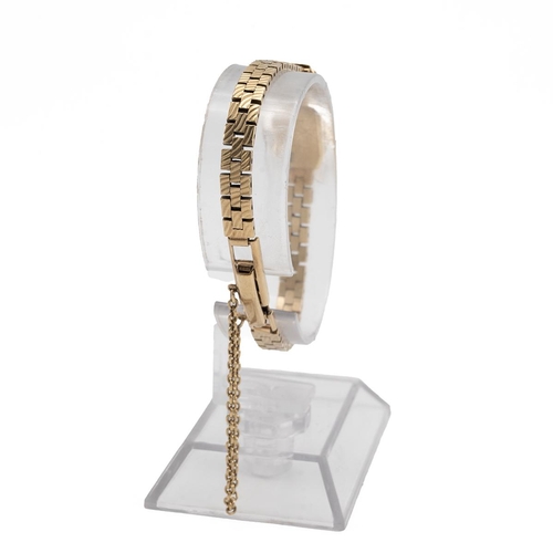 291 - 9ct gold ladies watch and strap, on a brick link strap, 14.90 grams.