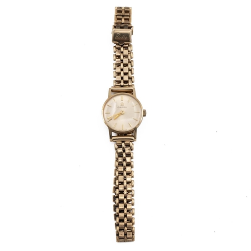 296 - 9ct Omega ladies wristwatch hallmarked 375 9ct the dial with batons, with gate bracelet strap.