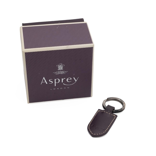 328 - Asprey of London: white metal key ring (stamped 925) with Asprey branded leather tab, in presentatio... 