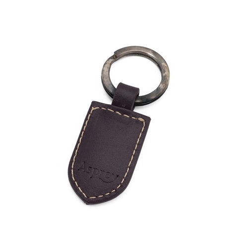 328 - Asprey of London: white metal key ring (stamped 925) with Asprey branded leather tab, in presentatio... 