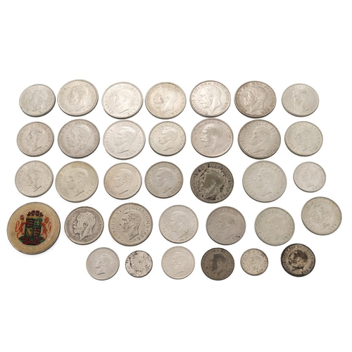 116 - Thirty-three (33) British pre-1947 50% silver coins, weighing 390g, including George V and George VI... 