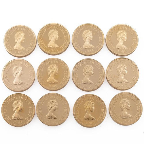 120 - 1983-1989 Jersey Parishes gold proof twelve-coin One Pound set. Includes 1983 St Helier, 1984 St Sav... 