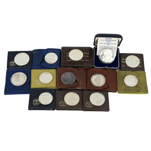 178 - Thirteen (13) Israeli silver coins in cases, including 1975 Hanukka (x2), 1976 Hanukka (x2), 1975 Pi... 