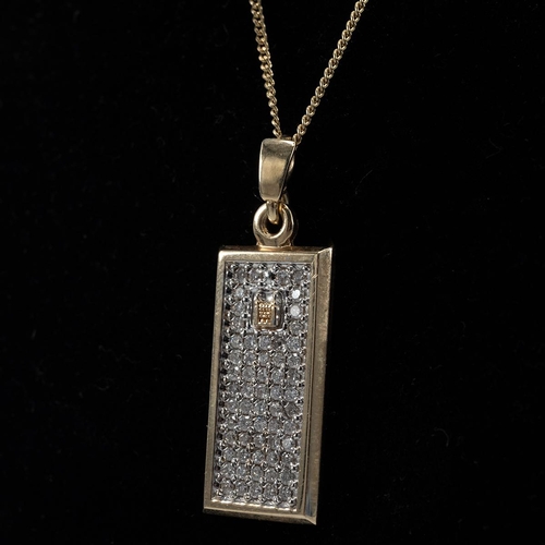 9 - 9ct gold pendant and chain, the pendant set with a panel of white stones, marked 