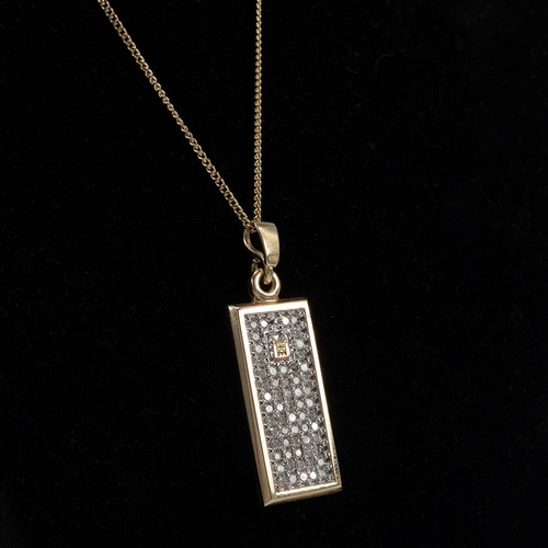 9 - 9ct gold pendant and chain, the pendant set with a panel of white stones, marked 