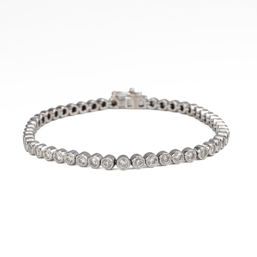 10 - A diamond tennis bracelet, set with 50 brilliant cut diamonds, totalling approximately 3.5 carats,  ... 