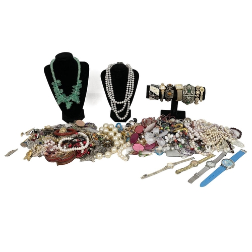 28 - A collection of costume jewellery including necklaces, bangles, watches, earrings, Cinnabar bangle e... 