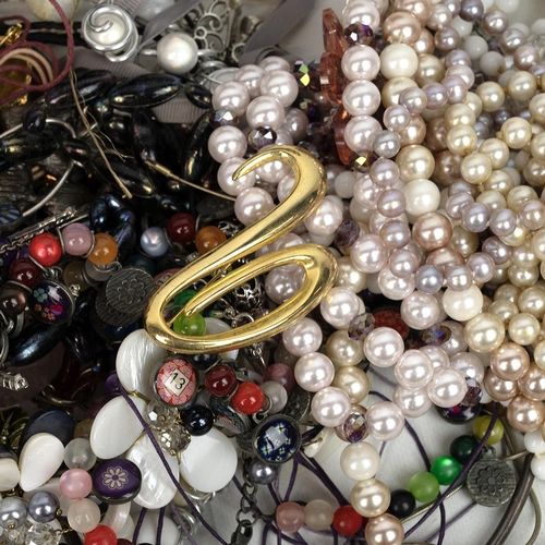 28 - A collection of costume jewellery including necklaces, bangles, watches, earrings, Cinnabar bangle e... 