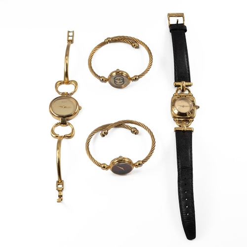 36 - Collection of four lady's Gucci watches, two on wire twist straps.