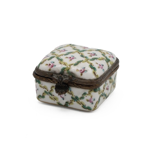 39 - A Sevres style patchwork box, the hinged top decorated with flowers, with a gilt metal outline.