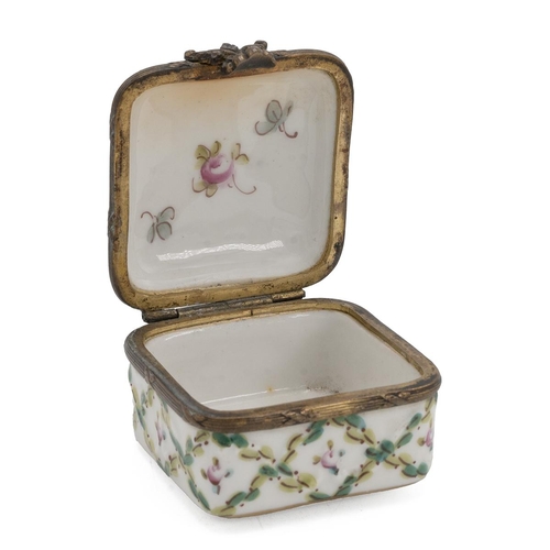 39 - A Sevres style patchwork box, the hinged top decorated with flowers, with a gilt metal outline.