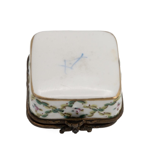 39 - A Sevres style patchwork box, the hinged top decorated with flowers, with a gilt metal outline.