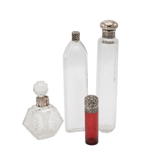 40 - Four silver topped scent bottles, including a ruby glass scent bottle