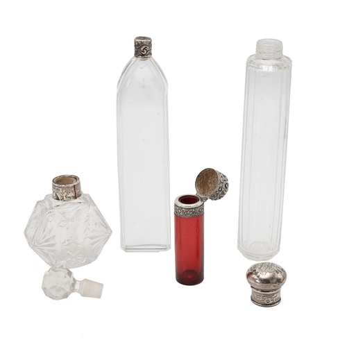 40 - Four silver topped scent bottles, including a ruby glass scent bottle