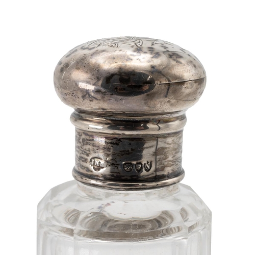 40 - Four silver topped scent bottles, including a ruby glass scent bottle