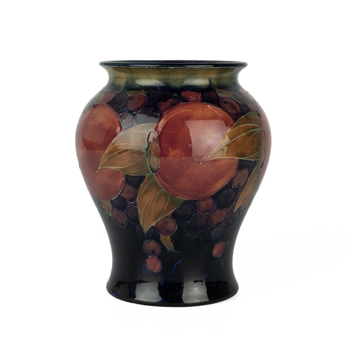 48 - Early 20th century Moorcroft vase decorated in the pomegranate pattern and ochre, on cobalt ground, ... 