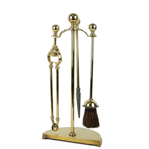 53 - Early 20th century brass fireside companion set comprising poker, tongs, brush and stand. Height 45c... 