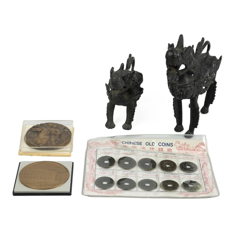 59 - Two Chinese brass models of dragons, along with a collection of Chinese coins and two commemorative ... 