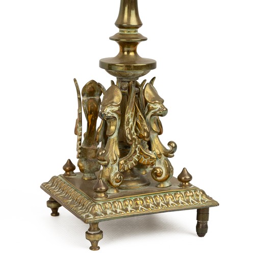 61 - Pair of Silver plated corinthian column candlesticks, pair of brass candle sticks with four griffins... 