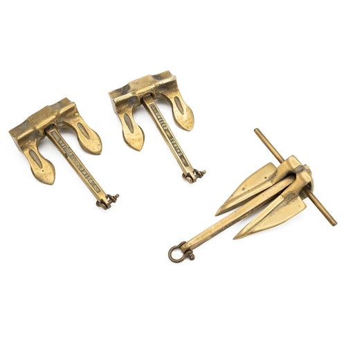 62 - Three early 20th Century brass self-stowing anchors - miniature sales representative's samples by Un... 