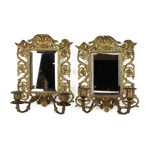 63 - Pair of brass framed mirror wall sconces, each with two candle holders (27cm x 22cm) and a pair of n... 