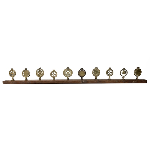 65 - 10x vintage Horse brasses mounted on wooden beam. These were probably placed on the back of a carria... 